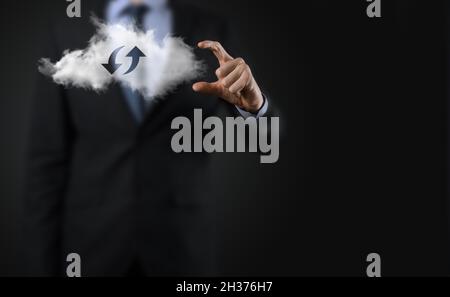 Cloud technology. Polygonal wireframe cloud storage sign with two arrows up and down on dark . Cloud computing, big data center, future infrastructure Stock Photo