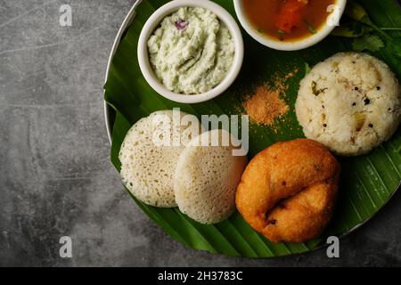 Vegetarian South Indian breakfast thali - Idli vada sambar chutney upma Stock Photo