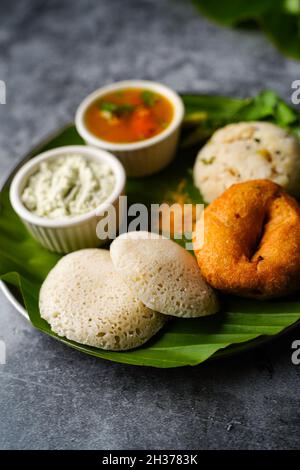 Vegetarian South Indian breakfast thali - Idli vada sambar chutney upma Stock Photo