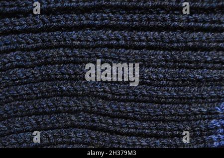 Pattern fabric made of wool. Handmade knitted fabric dark blue wool background texture Stock Photo
