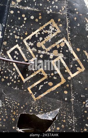 Swastika emblem on the damaged tail plane of a WWII Luftwaffe aircraft Stock Photo