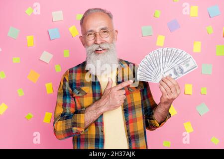 Photo of lucky cute mature man dressed checkered shirt finding great salary solution isolated pink stickers color background Stock Photo