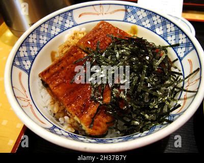 Traditional Japanese food Donburi unadon unagi or eel kabayaki served on top of a bowl of rice at local restaurant shop in Kyoto Prefecture of Kansai Stock Photo