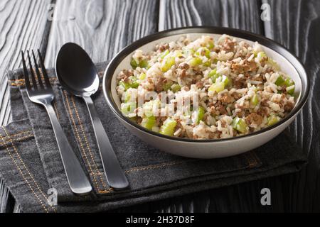 Dirty Rice is a delicious savory classic Cajun dish that gets its flavor from ground meat, cajun seasonings, and aromatic vegetables close-up in a pla Stock Photo