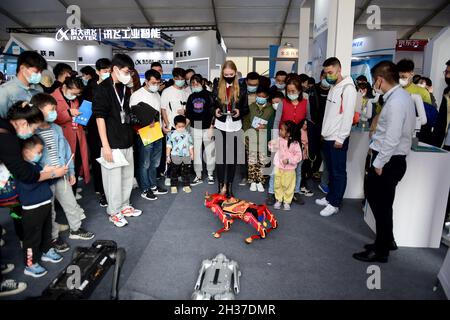 (211026) -- HEFEI, Oct. 26, 2021 (Xinhua) -- Ukrainian student Aly controls a robot at the 4th World Voice Expo in Hefei, capital of east China's Anhui Province, Oct. 24, 2021. Aly has been studying Chinese for seven years and now she is a graduate student at Anhui University. She has spent her time trying high-tech products at the World Voice Expo and believes that these products could make a better life for us. Companies and developers specializing in artificial intelligence (AI) and speech technology gathered in Hefei, capital of east China's Anhui Province on Monday for the 4th World Voi Stock Photo