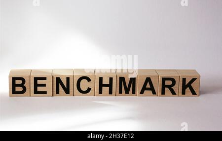 The word etalon is written on wooden cubes and a white background. Stock Photo