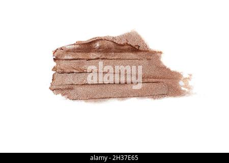 Macro photography of the cosmetic highlighter with shimer.Isolated on white swatch. Stock Photo