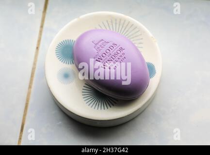 A Woods of Windsor tablet of Lavender soap in a soap dish on a bathroom window sill, England, UK Stock Photo