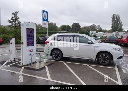 A Pod Point Volkswagen EV or electric vehicle charging point at a Tesco supermarket car park, Kidsgrove, Stoke on Trent, Staffordshire, England, UK Stock Photo