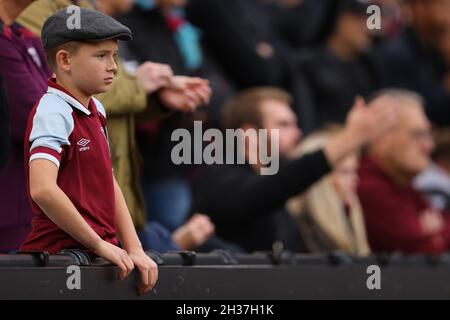 A young West Ham United fan takes in the match - West Ham United v Tottenham Hotspur, Premier League, London Stadium, London, UK - 24th October 2021  Editorial Use Only - DataCo restrictions apply Stock Photo