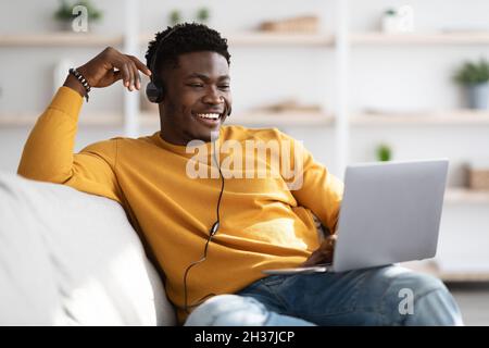 Handsome black guy having video call, using laptop Stock Photo