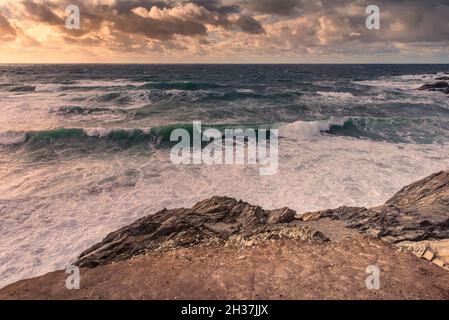 Evening light over a high tide at Little Fistral in Newquay in Cornwall. Stock Photo