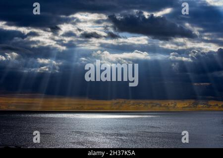 Stunning sunrays breaking through storm clouds in South Devon, UK Stock Photo