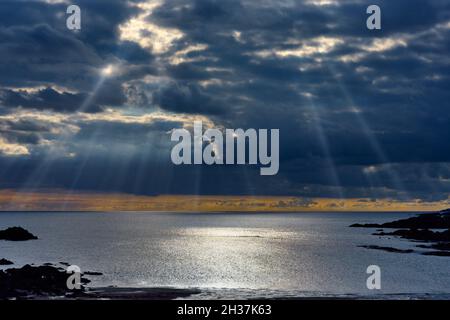 Stunning sunrays breaking through storm clouds in South Devon, UK Stock Photo