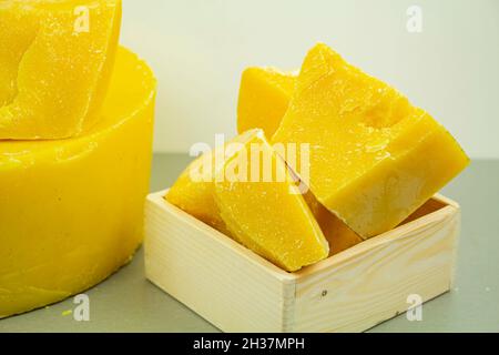 large pieces of natural beeswax, close-up, raw materials for candles, creams, soaps, eco-products Stock Photo