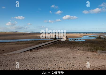 Bridge to Nowhere, Belhaven Bay, over Biel Water at low tide - John Muir Country Park, Dunbar, Scotland, UK Stock Photo