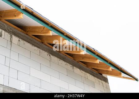 Gable overhang of the roof of a private house during construction Stock Photo