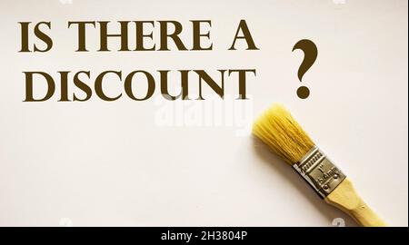 There is a discount, the text is written on a white background with a paint brush Stock Photo