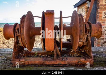 Rusty old boat winch on Brighton beach Stock Photo