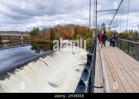 Quebec, Canada - October 20 2021 : Tourists sightseeing at the Montmorency Falls in the fall season. Stock Photo