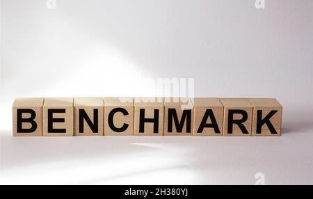 The word etalon is written on wooden cubes and a white background. Stock Photo