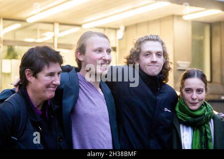 London, England, UK. 26th Oct, 2021. Highbury Corner Magistrates Court, London, UK, 26th October 2021. Tree Protectors Maria Gallastegui (62), Sebastian Roblin (27), Stefan Wright (28), Wictoria Zieke (26) walk out of Court at the end of the first day of trial. Despite last March's High Court ruling and the falling of every charge connected with the occupation of the tunnels under Euston Square on October 6, HS2 legal team amended the accusations only last Friday (22nd of October), and the tree protectors were still summoned to Court today.HS2 legal team considers the presence o Stock Photo