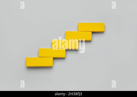 Yellow blocks on grey background Stock Photo