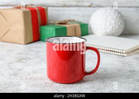 Stylish red cup on table Stock Photo