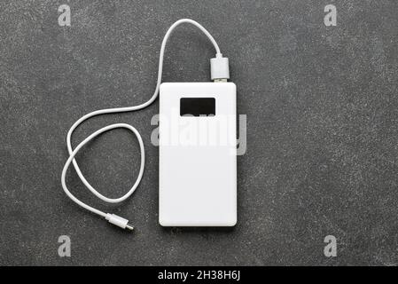 Modern power bank on black background Stock Photo