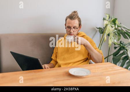 Teenager young man drinking coffee in cafe. Stock Photo