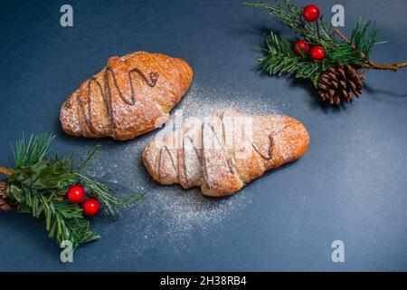 fresh christmas croissants on the blue background Stock Photo