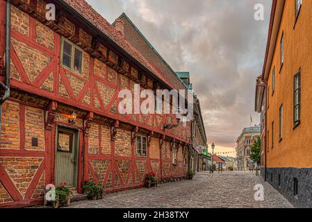 Apoteksgården an old half-timbered house in the light of street lamps and the first morning beams, Ystad, Sweden, September 14, 2021 Stock Photo