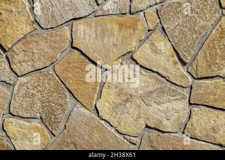 Stone wall with textured surface for wallpapers and background. Stock Photo