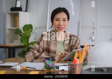 Engineer or architect meeting for project working with partner working and discuss with model 3D on tablet. Construction concept. Stock Photo