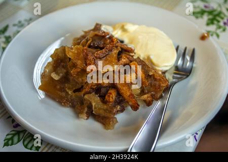 Apple pie served with ice cream. Stock Photo