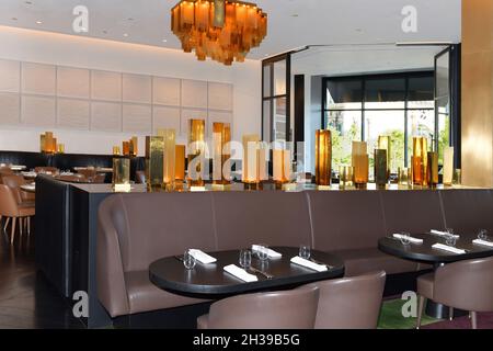 Nevada USA 09-04-21 On a table, beautiful golden vases decorate and divide the hall of the famous Spago restaurant located in the Bellagio Las Vegas Stock Photo