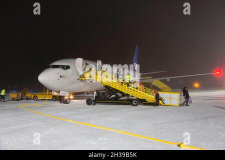 SAS, Airbus A 320 with passenger stairs in winter on snowy tarmac, Kiruna Swedavia Airport, Lapland, northern Sweden, Sweden Stock Photo