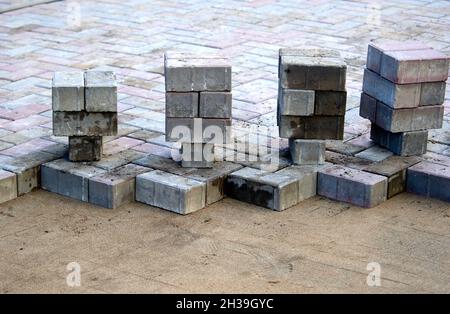 paving slabs prepared for laying on a sand cushion Stock Photo