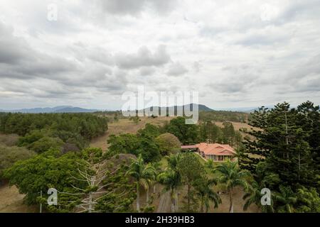 Mackay, Queensland, Australia - October 2021: Drone aerial flying over country homestead nestled amongst trees Stock Photo