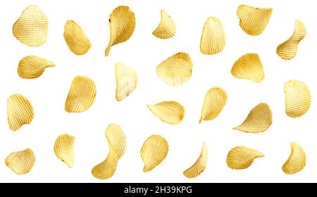 Wavy potato chips flying in the air, isolated on white background Stock Photo