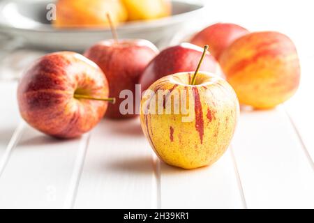 Fresh autumn apples on white table. Stock Photo
