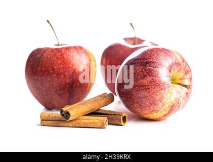 Fresh autumn apples and cinnamon sticks  isolated on white background. Stock Photo