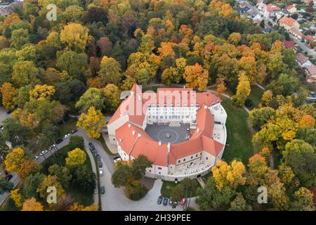 Aerial view of historial Castle surrounded by English park with rare trees in autumn colors, Pezinok, Slovakia Stock Photo