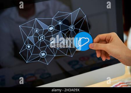 Close-up image of UI designer working on icons design for new cloud service Stock Photo