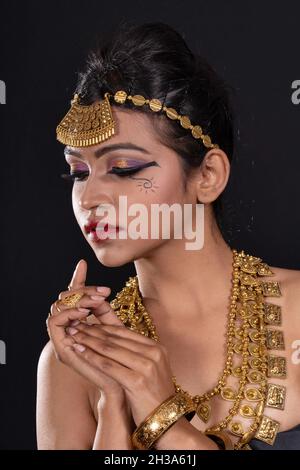 Woman in Tribal attire look. Black background Stock Photo