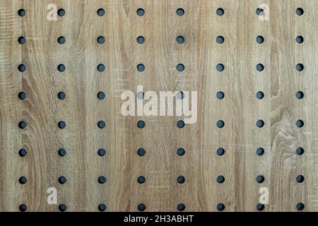 Abstract textured wooden background with holes. Stock Photo