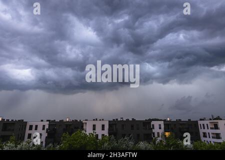 Rainy clouds over apartment houses in Warsaw, Poland Stock Photo