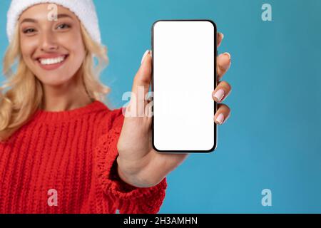 Woman showing empty smartphone screen closeup to camera Stock Photo