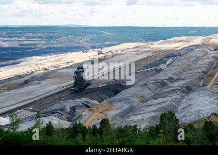 Hambach, Germany. The Hambach Brown Coal Open Pit Mine fuelles an Electrical Power Plant, but is considered to exhaust to much carbon and CO2. In times of Global Warming this method of electricity production is outdates, many people beleive. Aide this issue, Open Pit Mines have a huge impact on landscape and water management. Stock Photo