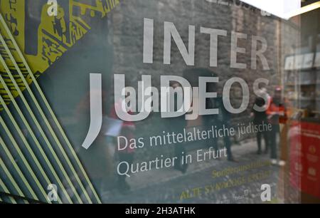 Erfurt, Germany. 27th Oct, 2021. "Inter Judeos" is written on a poster next to the entrance to the Old Synagogue. The special exhibition "'Inter Judeos' the Medieval Jewish Quarter in Erfurt" makes the Jewish medieval heritage visible in public space. It can be seen from 28 October to 22 May 2022. Credit: Martin Schutt/dpa-Zentralbild/dpa/Ģ����ý Live News Stock Photo
